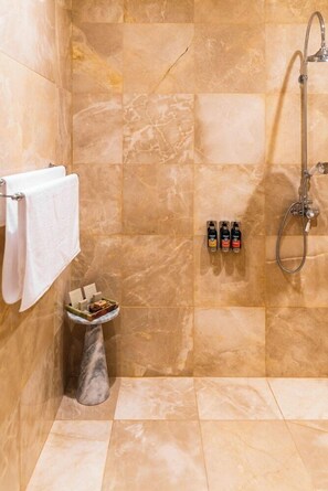 Designer toiletries, hair dryer, bathrobes, slippers