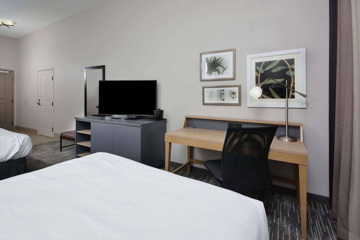 Desk, laptop workspace, blackout drapes, iron/ironing board