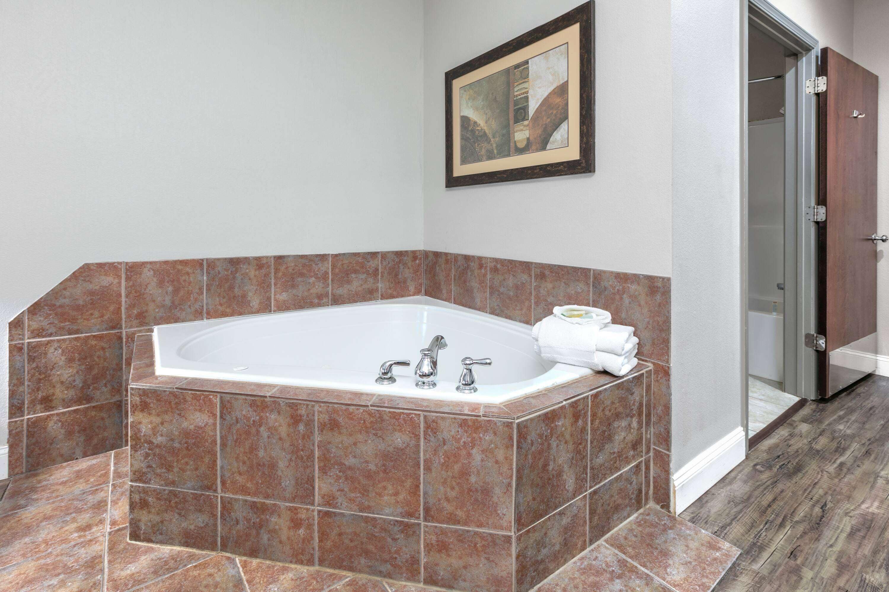 deluxe room, 1 king bed, non smoking | desk, iron/ironing board, free cots/infant beds, rollaway beds