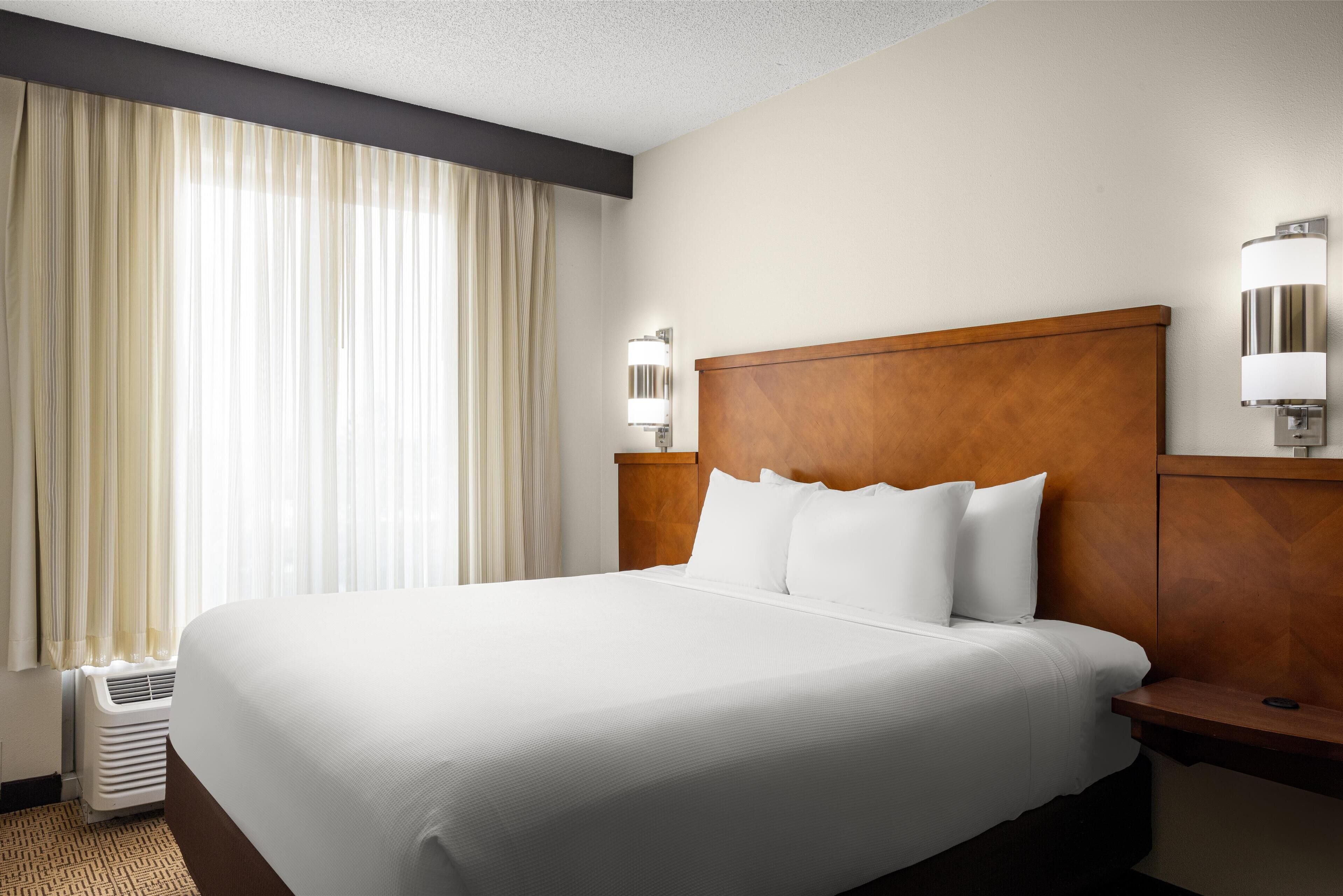 down duvets, pillow-top beds, desk, blackout curtains