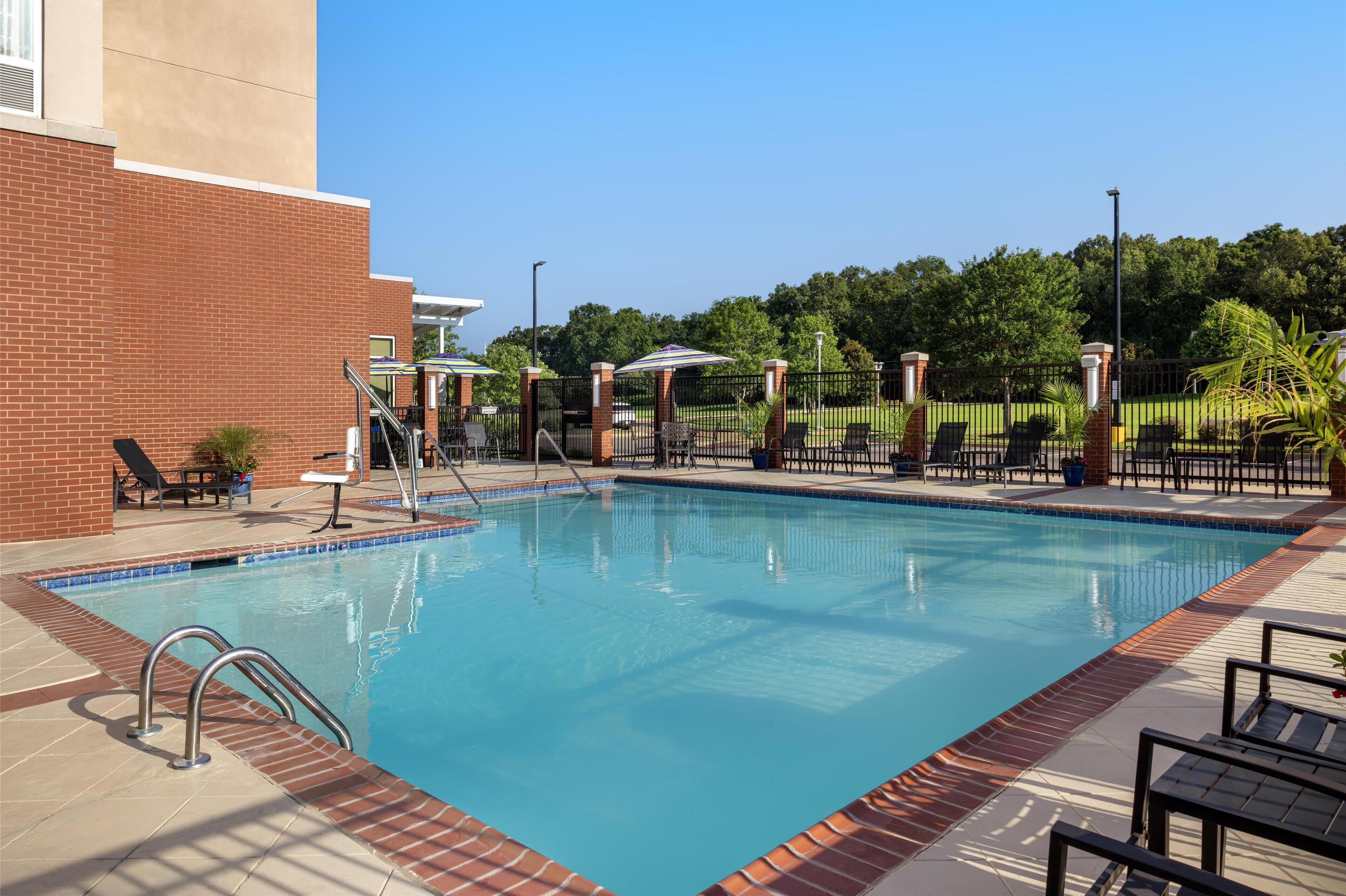 seasonal outdoor pool, open 10:00 am to 10:00 pm, pool umbrellas