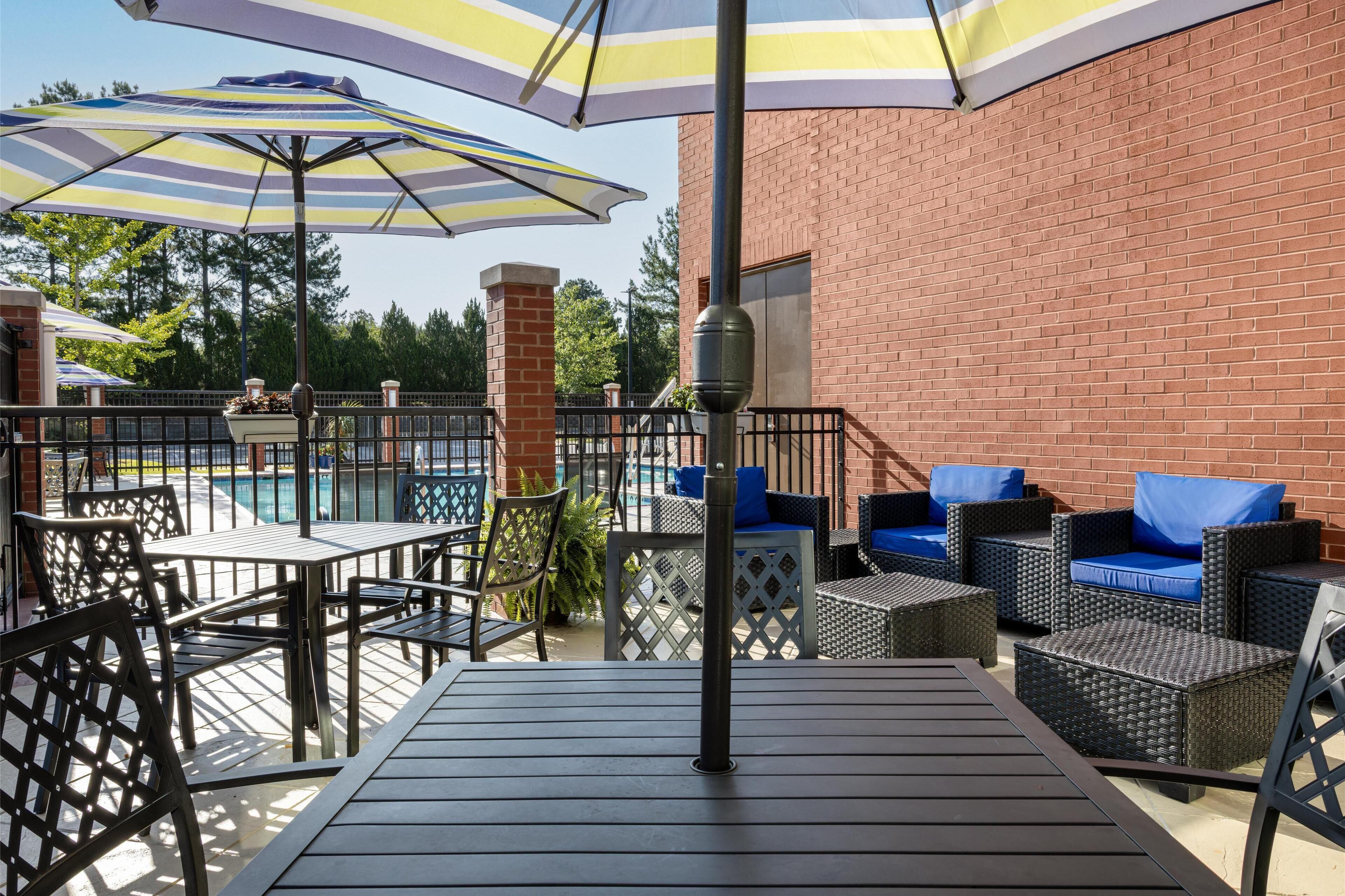 seasonal outdoor pool, open 10:00 am to 10:00 pm, pool umbrellas