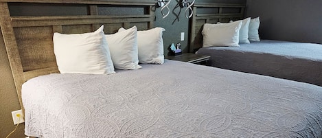 Premium bedding, pillow-top beds, blackout curtains, iron/ironing board