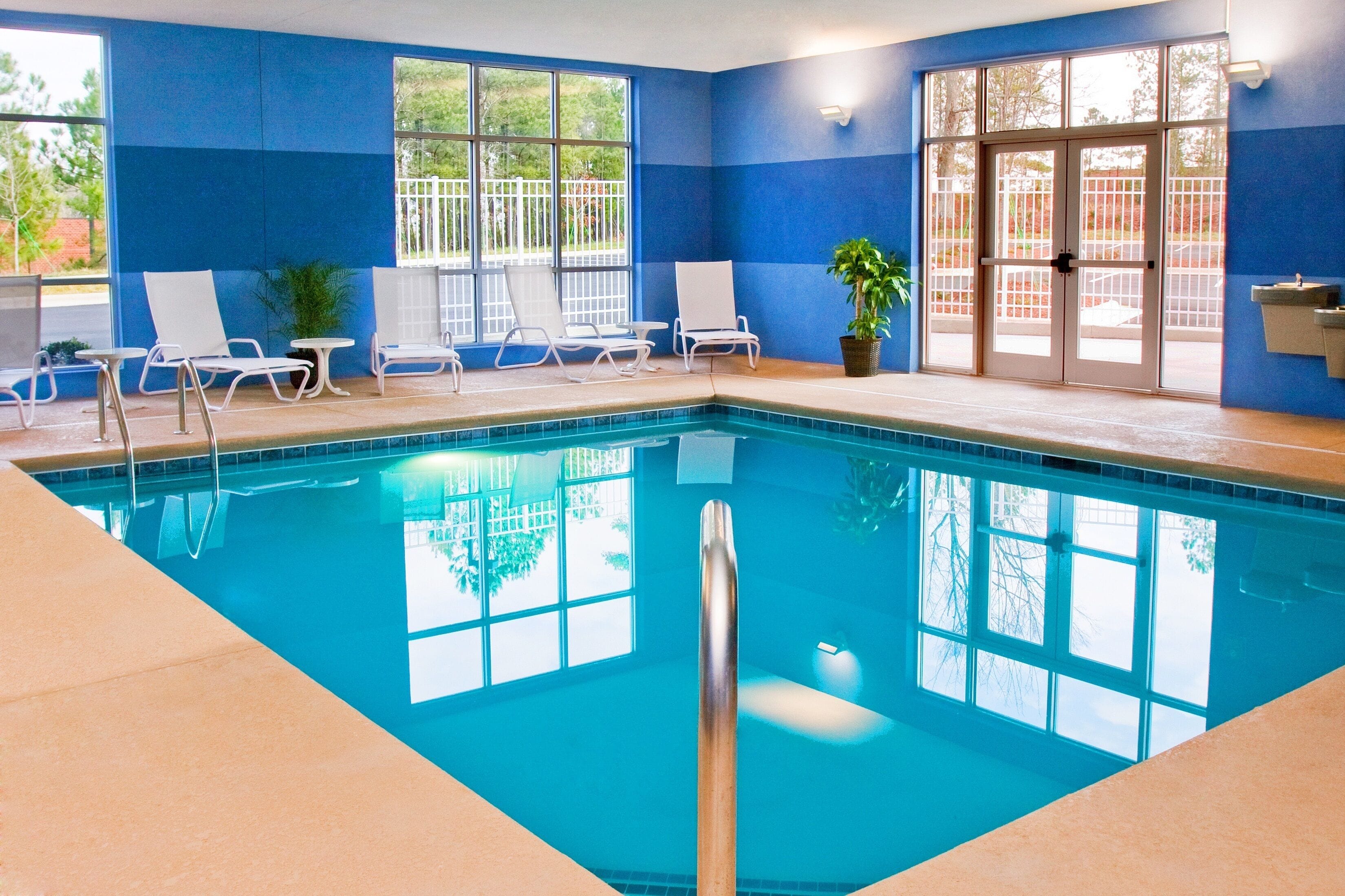 indoor pool, open 7:00 am to 9:00 pm, pool umbrellas, pool loungers