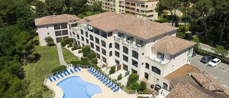 Seasonal outdoor pool, pool umbrellas, pool loungers