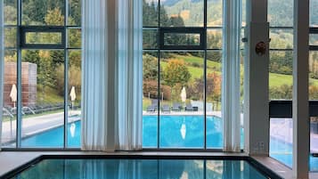 Indoor pool, 2 outdoor pools, open 7:00 AM to 9:00 PM, pool umbrellas