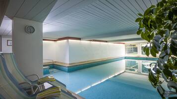 Indoor pool, pool umbrellas, pool loungers