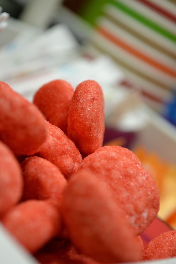 A close-up of red, sugar-coated candies.