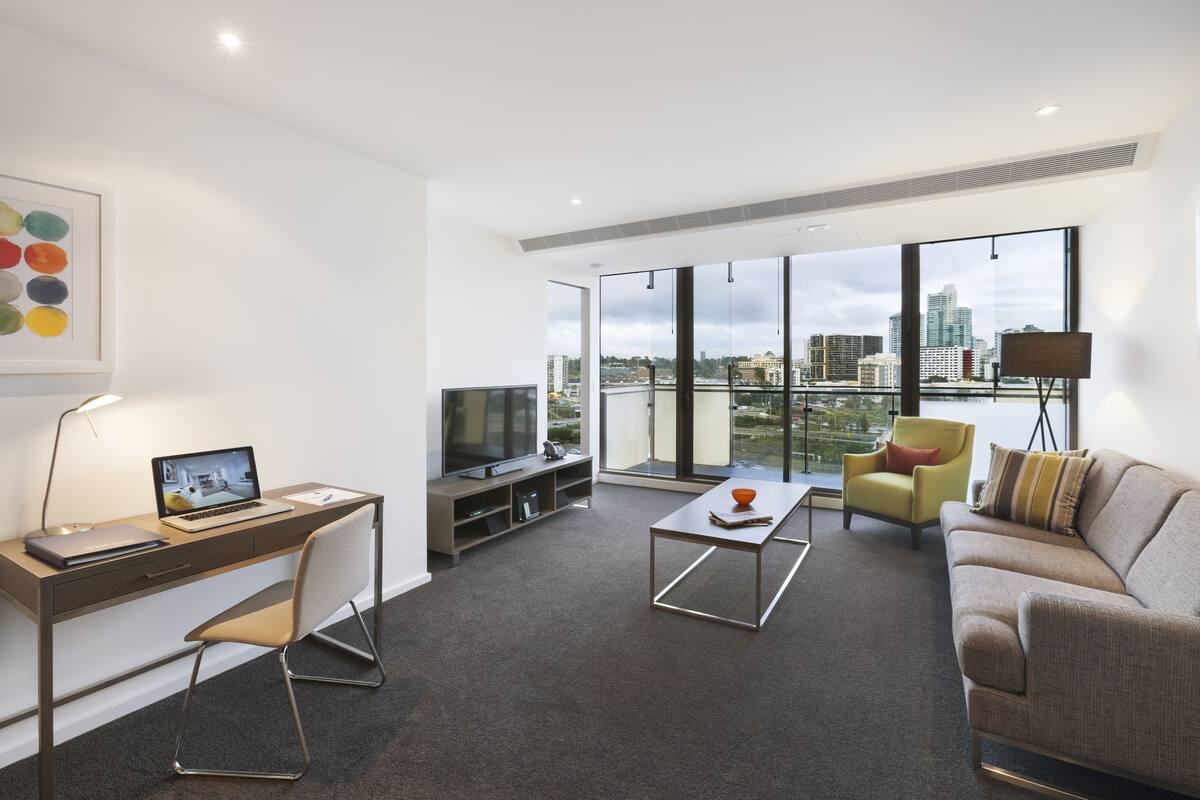 Three Bedroom Apartment | Living room | 32-inch LCD TV with digital channels, TV, DVD player