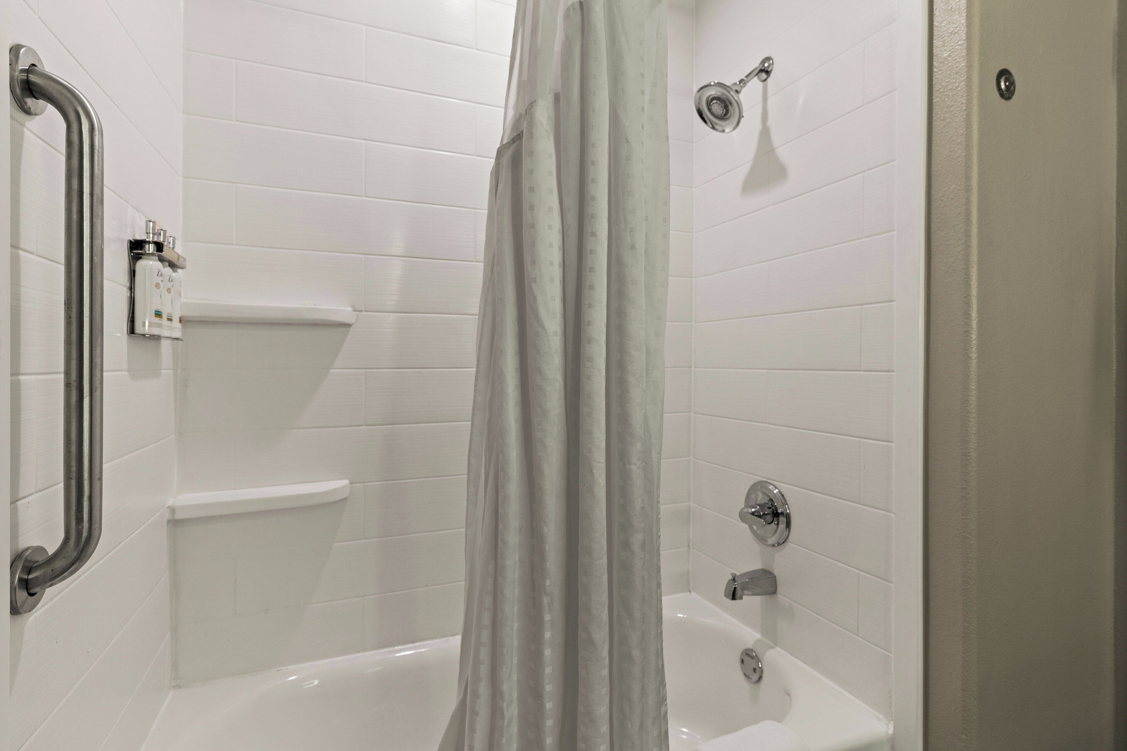 bathtub, hair dryer, towels