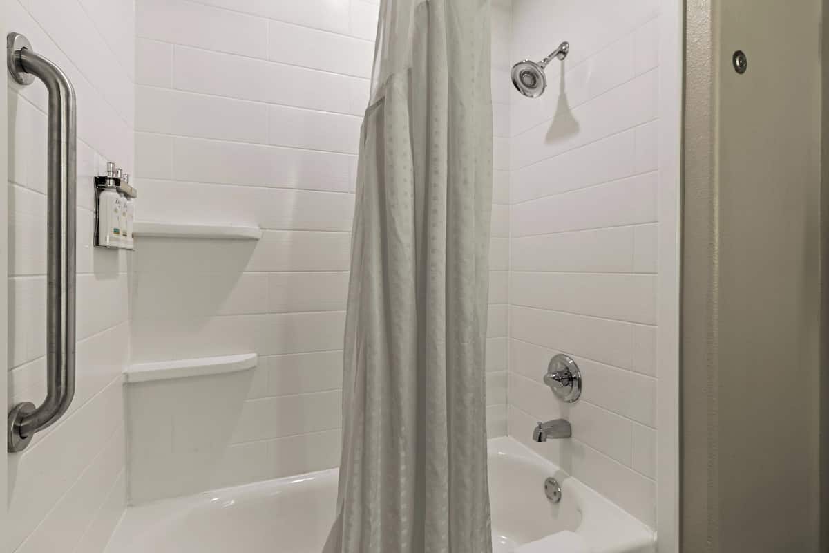 bathtub, hair dryer, towels