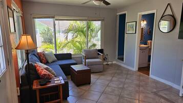 Deluxe Cottage, 1 Bedroom | Living area | 40-inch flat-screen TV with cable channels, table tennis
