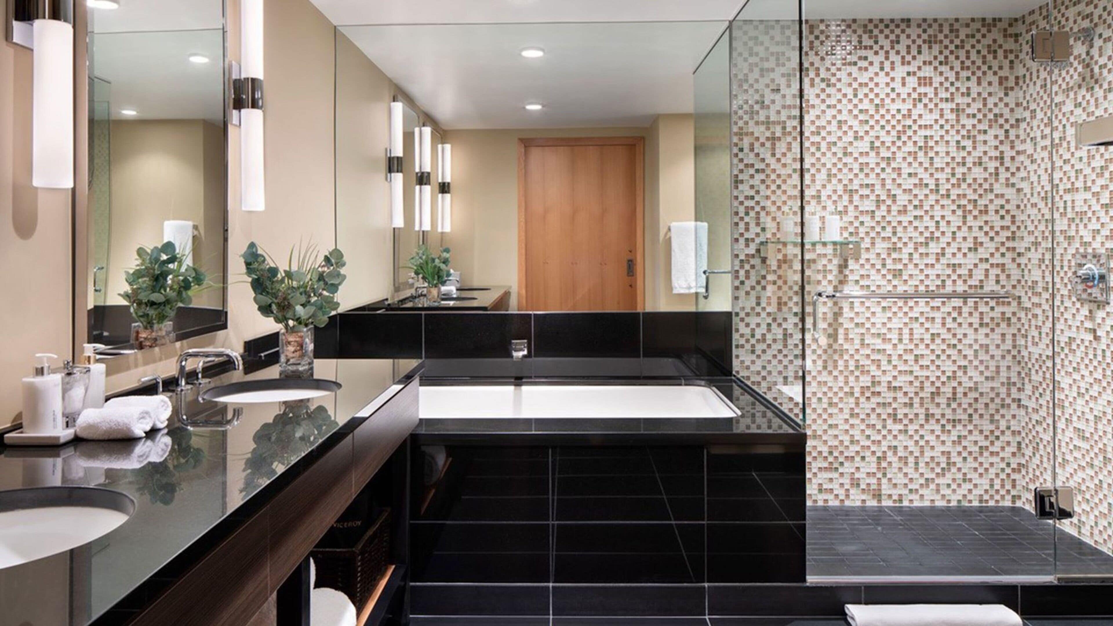 combined shower/bathtub, designer toiletries, hair dryer, bathrobes