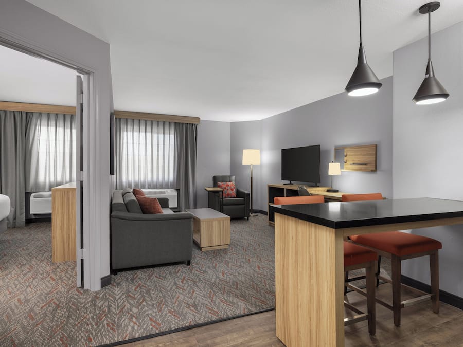 Suite, 1 Bedroom | Desk, blackout drapes, iron/ironing board, free WiFi