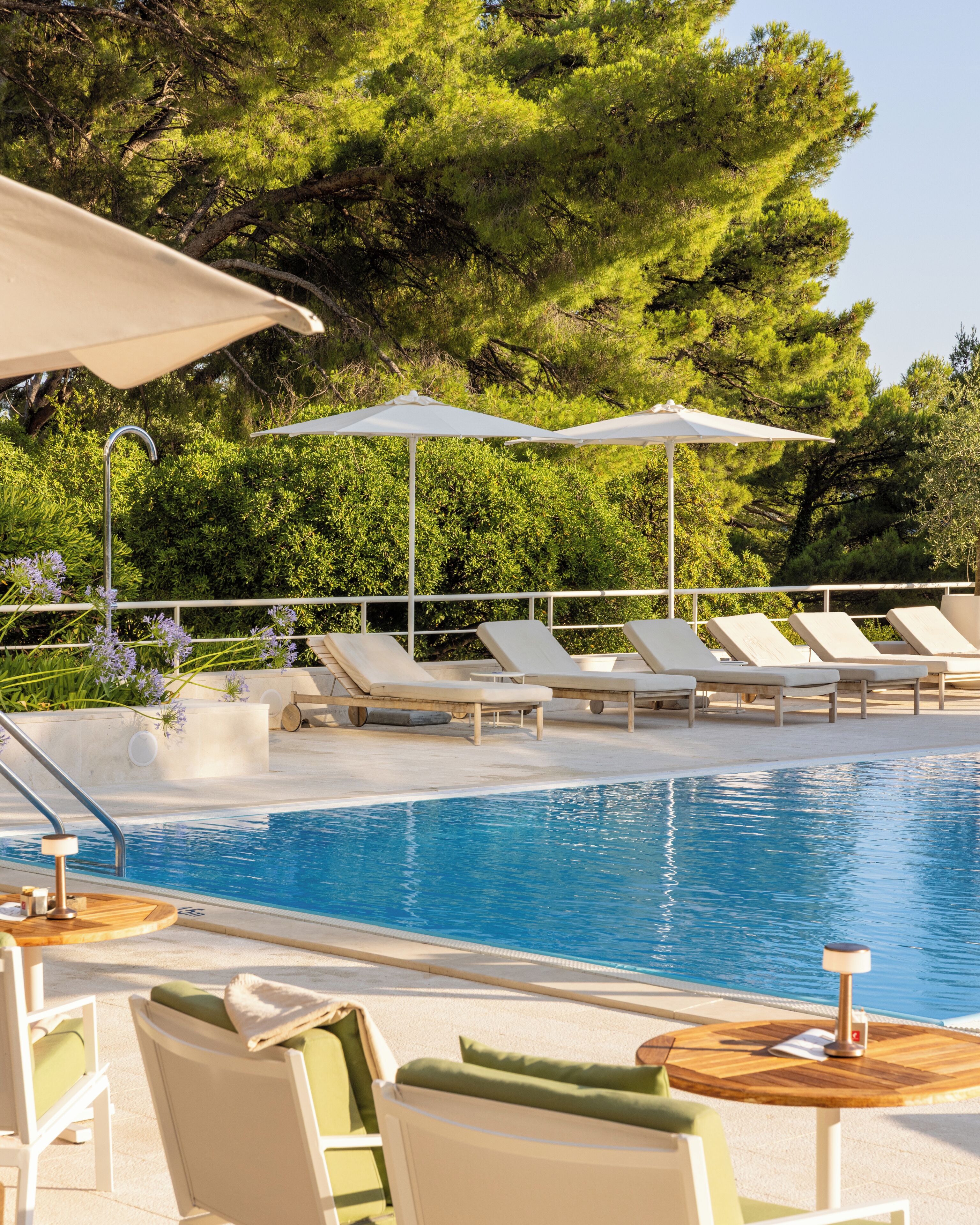 outdoor pool, pool umbrellas, pool loungers