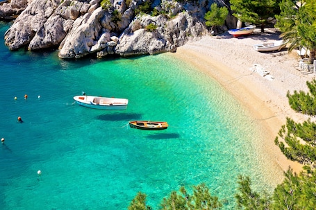 On the beach, sun-loungers, beach umbrellas. Maestral Adults Exclusive Hotel