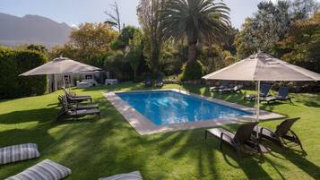 Outdoor pool, pool umbrellas, sun loungers