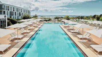 Indoor pool, pool umbrellas, pool loungers