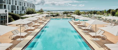 Indoor pool, pool umbrellas, pool loungers