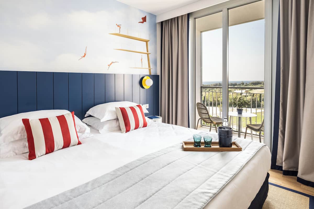 family suite, 2 bedrooms, balcony, partial sea view | 2 bedrooms, minibar, in-room safe, blackout curtains