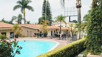 Outdoor pool, open 8 AM to 9 PM, pool umbrellas, sun loungers