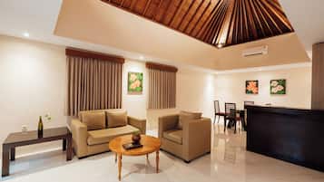Villa, 1 Bedroom, Pool View | Living area | 32-inch flat-screen TV with digital channels, TV