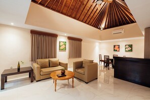 Villa, 1 Bedroom, Pool View | Living area | 32-inch flat-screen TV with digital channels, TV
