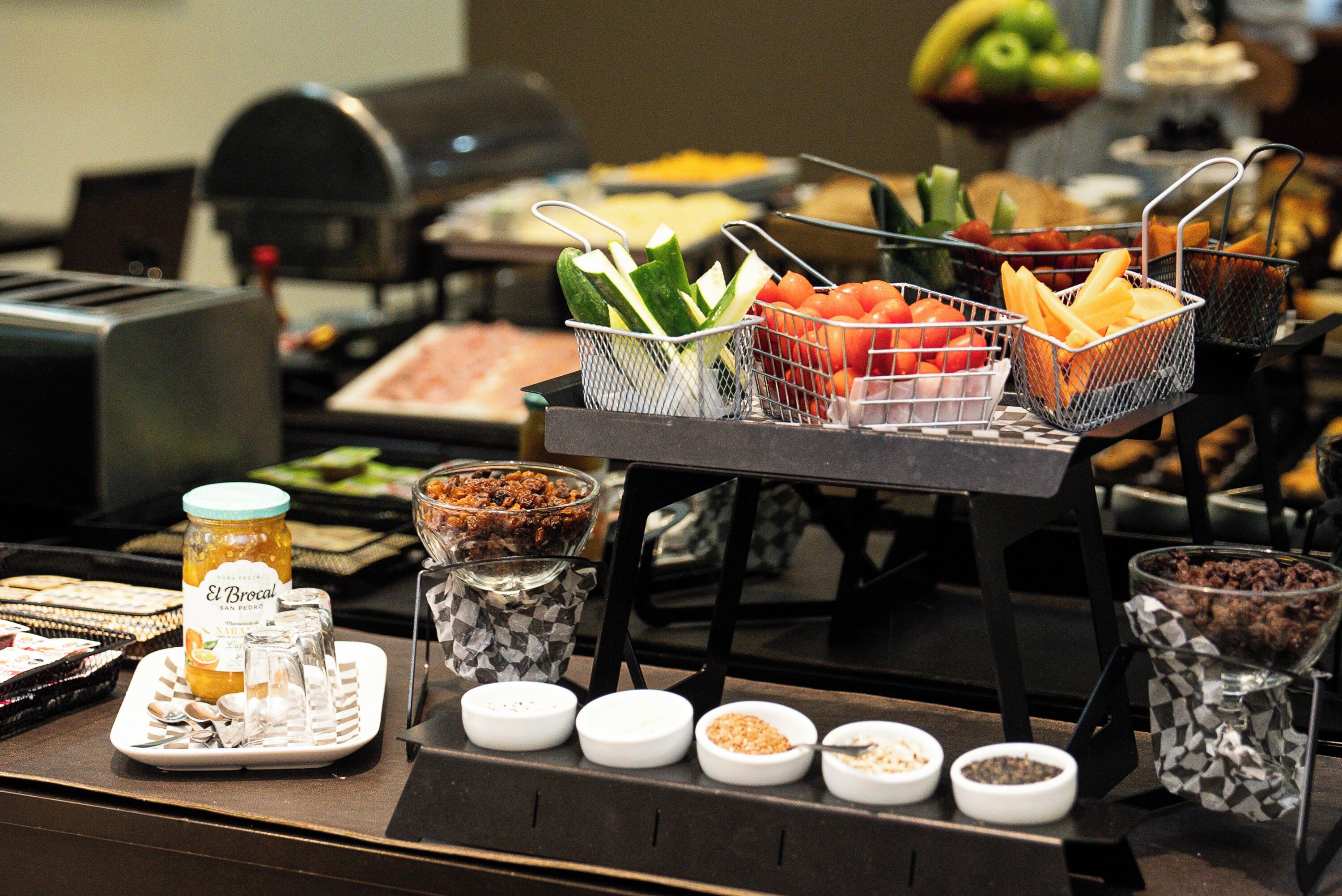 A buffet with various food items and condiments.