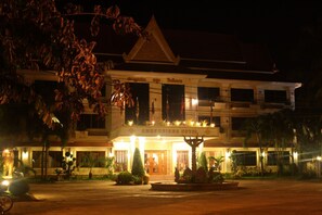 A hotel with a traditional architectural style, featuring a prominent entrance with a staircase leading up to the main doors. - Angkoriana (Siem Reap)