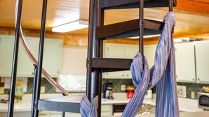 A spiral staircase with metal railings and a wooden interior. - Shalom House Bed and Breakfast (Tifton)