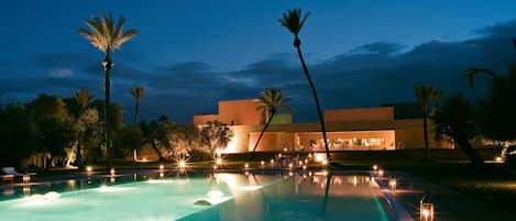 Indoor pool, pool umbrellas, pool loungers