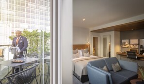 Deluxe King Room with Balcony | Bathroom | Hair dryer, slippers, towels, soap -  Clayton Hotel London Wall (London)