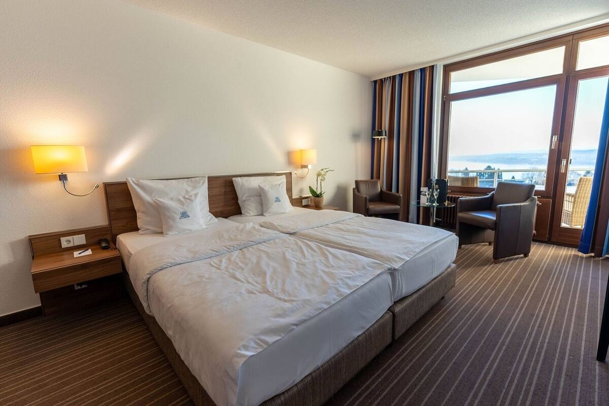 Hypo-allergenic bedding, free minibar items, in-room safe, desk