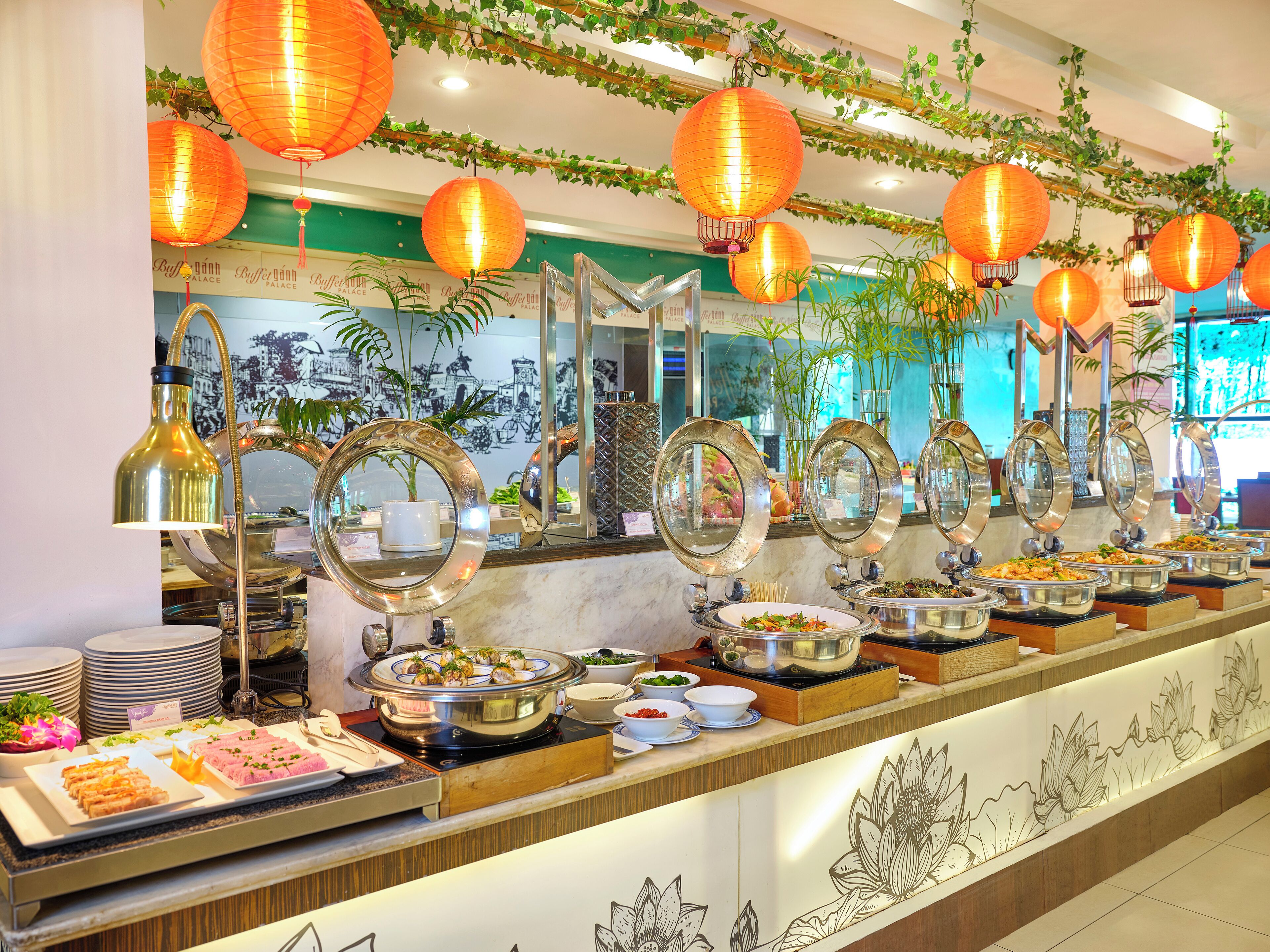 A buffet setup with various food items and a decorative mirror arrangement.
