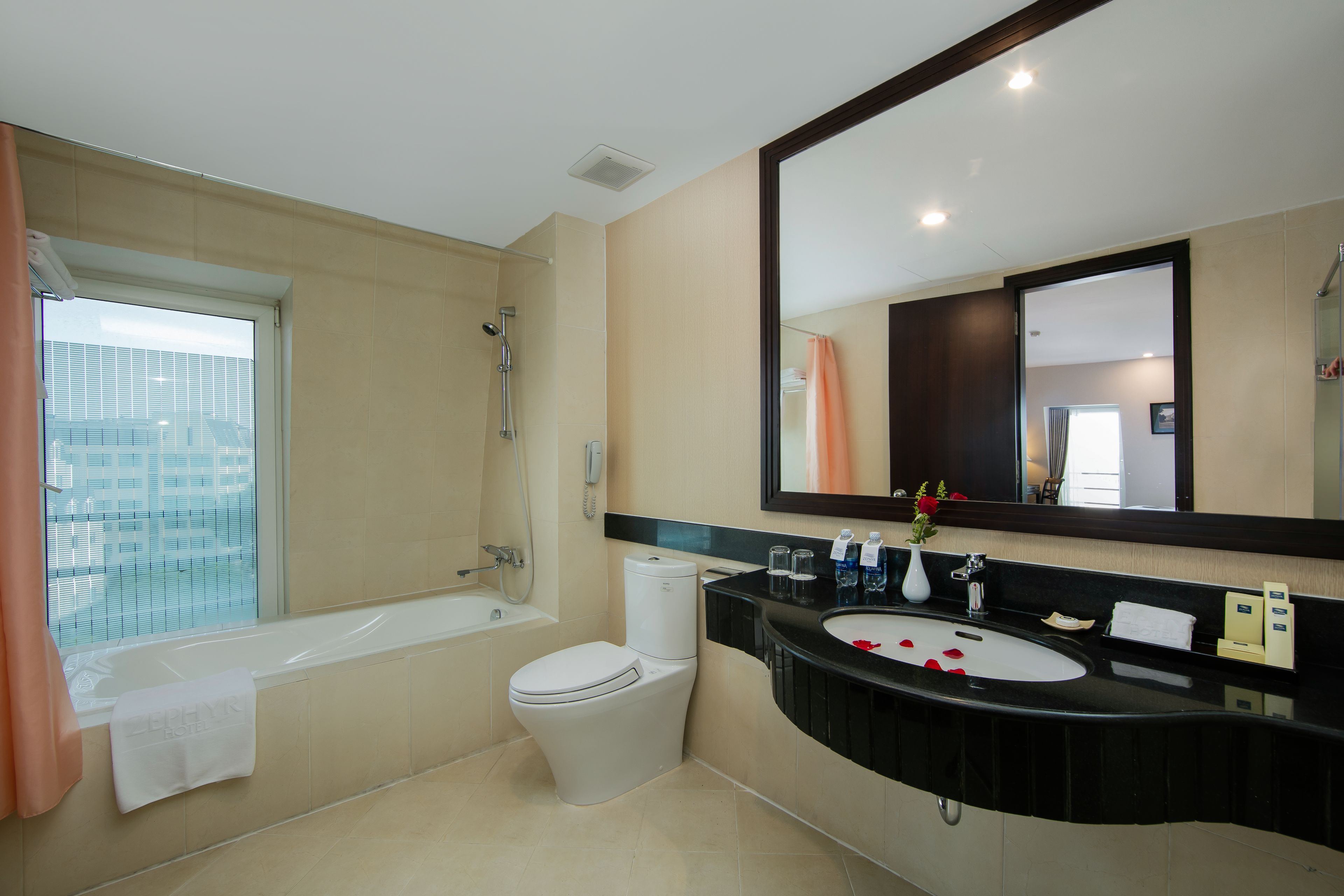 zephyr suites with city view | bathroom | rainfall showerhead, free toiletries, hair dryer, slippers