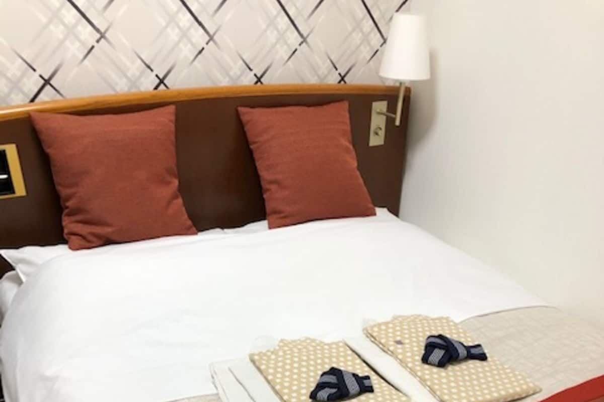 Down duvets, pillow-top beds, desk, blackout curtains