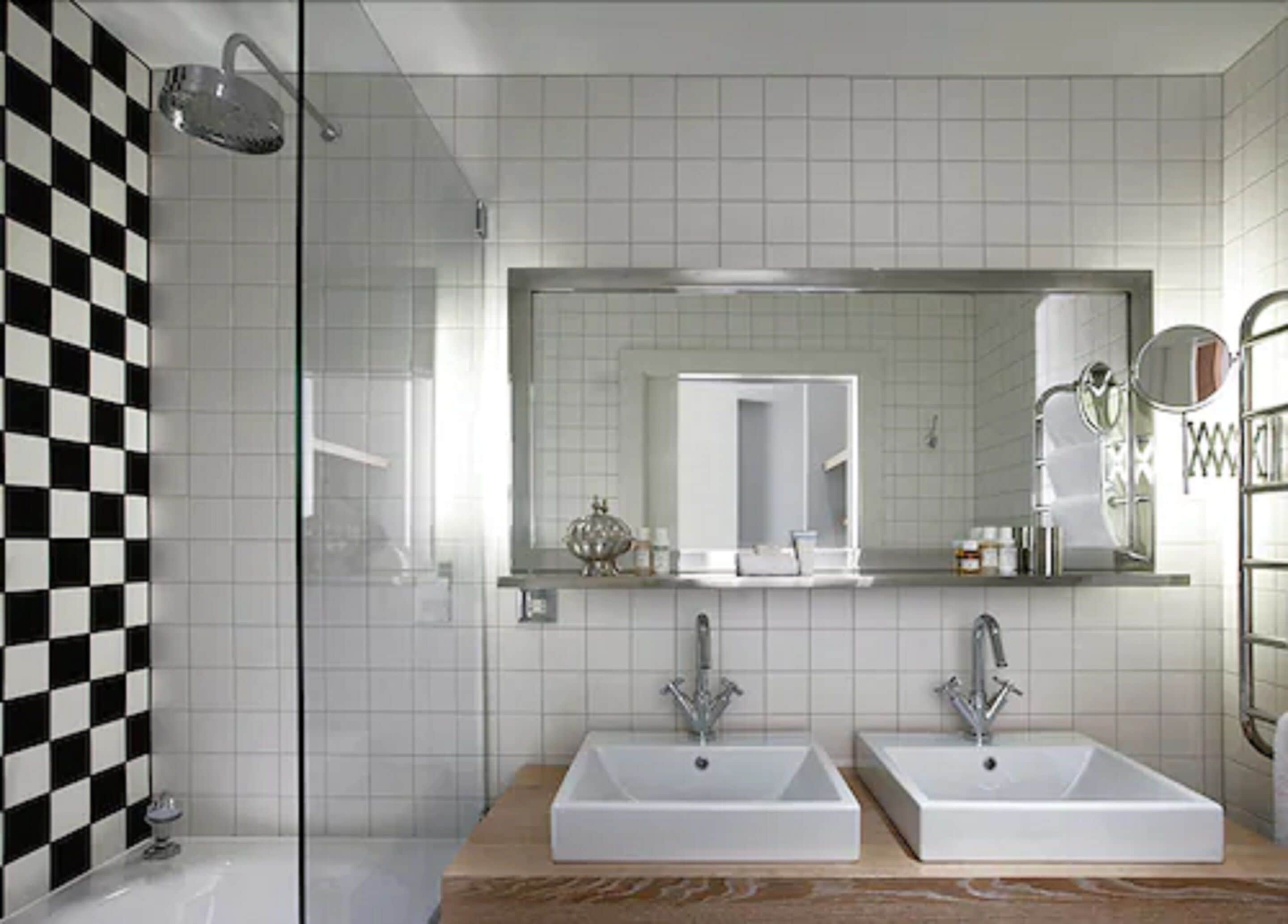 corner room | bathroom | designer toiletries, hair dryer, bathrobes, slippers