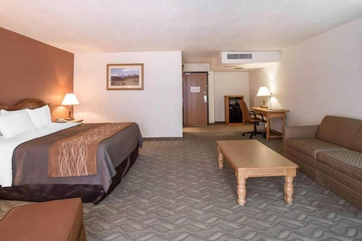 Premium bedding, desk, laptop workspace, iron/ironing board
