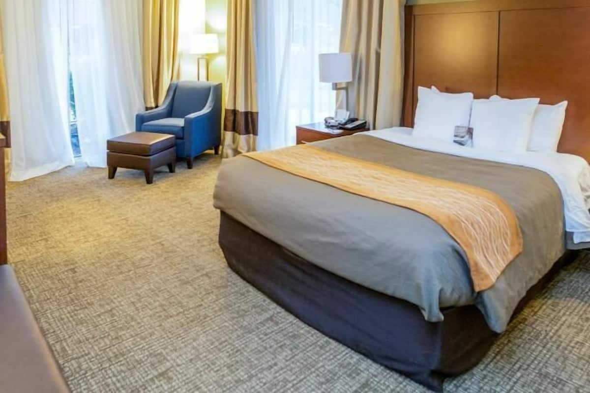 Premium bedding, desk, laptop workspace, iron/ironing board