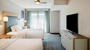 A hotel room with two beds, a flat-screen TV, a ceiling fan, and a large window with curtains. - Homewood Suites by Hilton Pittsburgh Southpointe (Canonsburg)