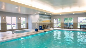 An indoor swimming pool with clear water, a lifeguard chair, and a mural on the wall. - Homewood Suites by Hilton Pittsburgh Southpointe (Canonsburg)
