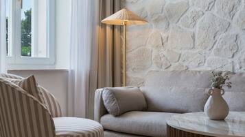 Junior suite Sea side | Living room | 78-cm LCD TV with satellite channels, TV