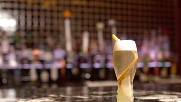 A cocktail with a unique presentation on a bar counter.