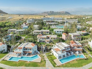 A resort with multiple villas, each with a private pool and surrounded by lush greenery. - Iberostar Creta Mare - All inclusive (Mylopotamos)