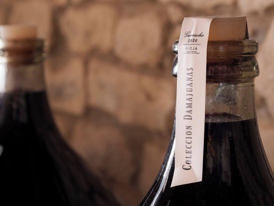 Two bottles of wine with labels, one of which reads "Cava 2020."