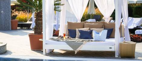 2 outdoor pools, open 7:30 AM to 10:00 PM, pool cabanas (surcharge)