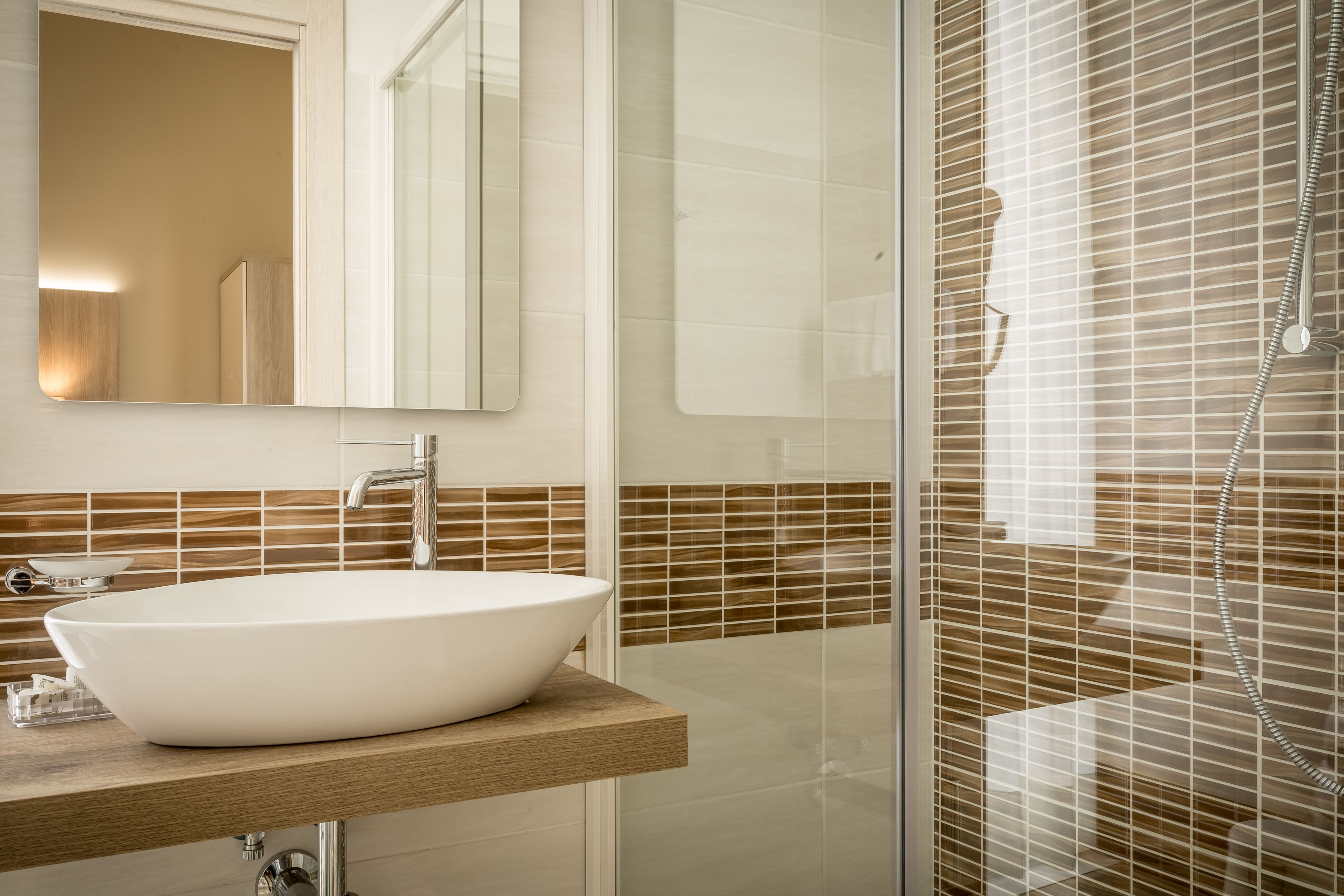 superior triple room | bathroom | shower, free toiletries, hair dryer, bidet