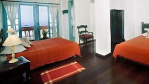Suite, Sea View | Minibar, in-room safe, iron/ironing board (on request) - Pousada Villa Carmo (Salvador)