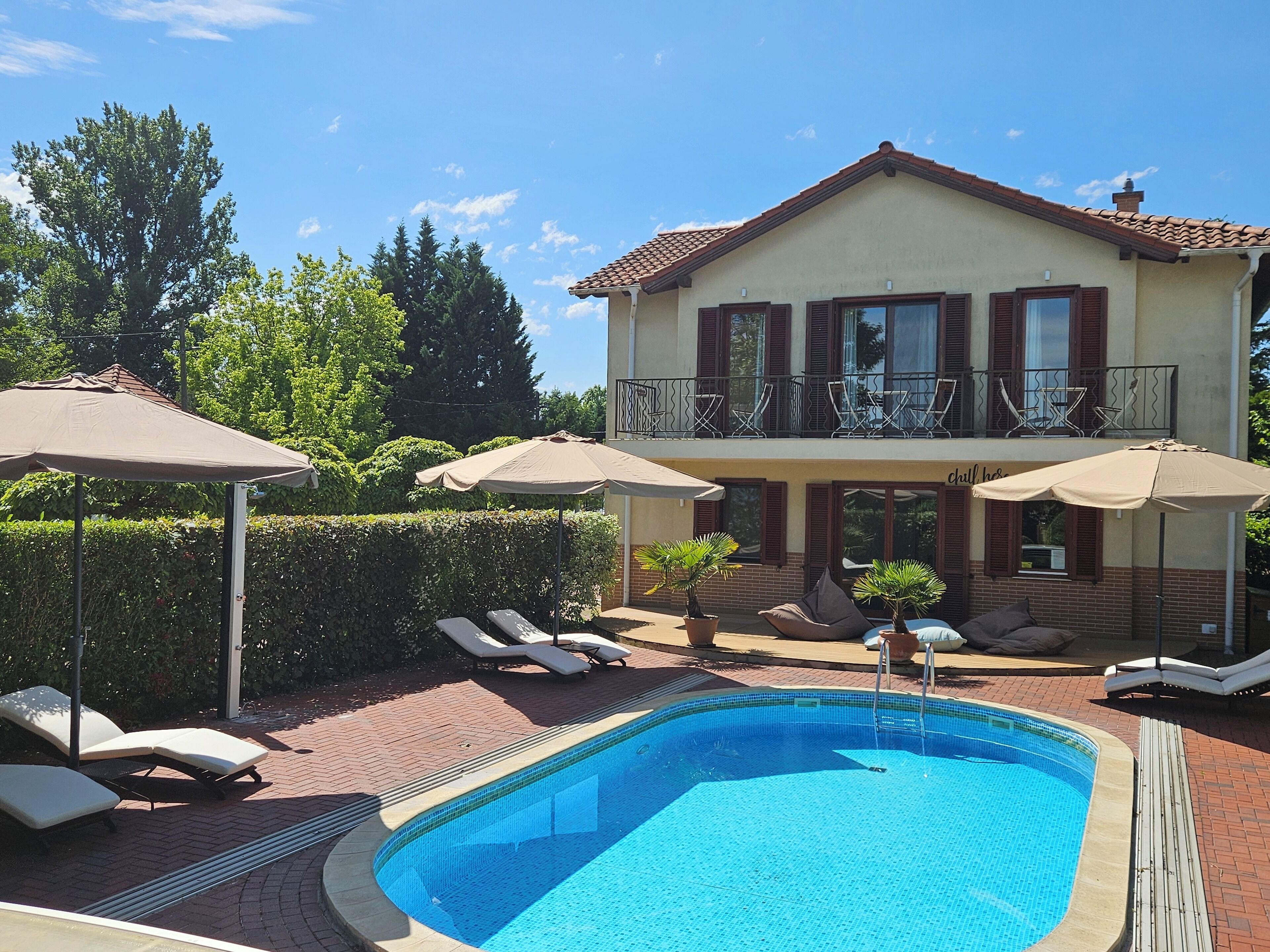 Seasonal outdoor pool, pool umbrellas, pool loungers