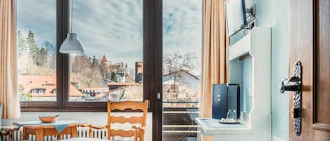 Basic Single Room, 1 Bedroom | Living area | Flat-screen TV